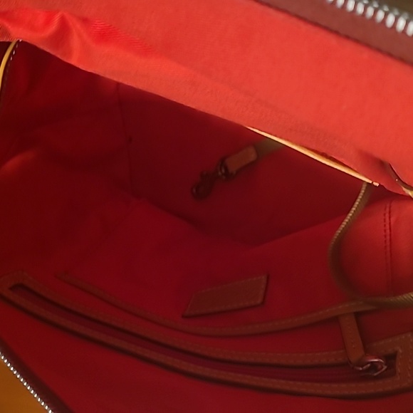 Dooney & Bourke pocket book new never used
